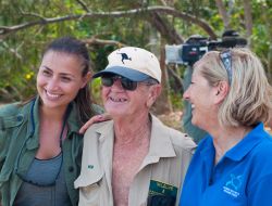 Jennie Gilbert and Bob Irwin filming a turtle release on Fitzroy Island